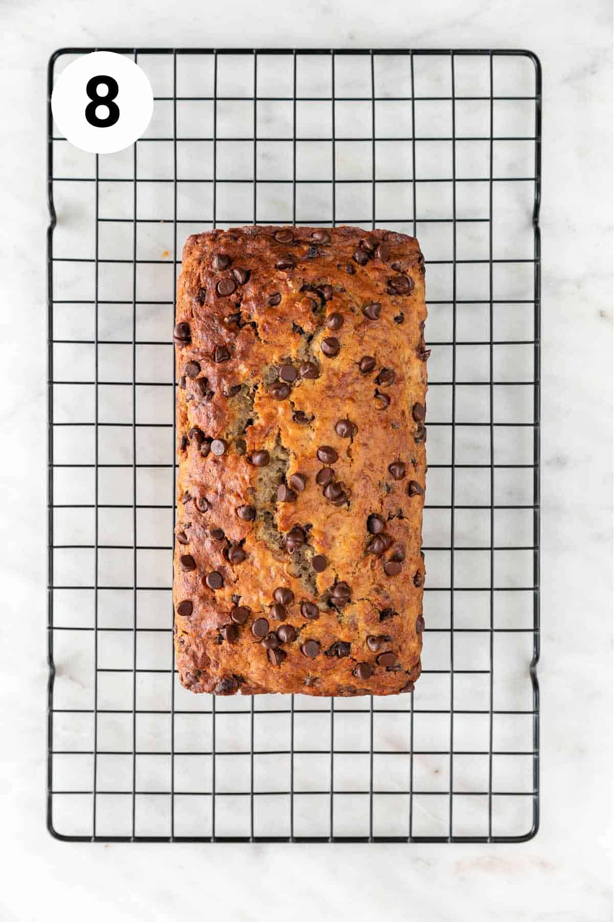 Baked vegan banana bread on a cooling rack