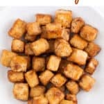 Overview of a dish with pan-fried tofu cubes and the text crispy pan-fried tofu.