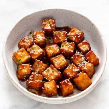 Crispy sesame tofu served in a bowl.