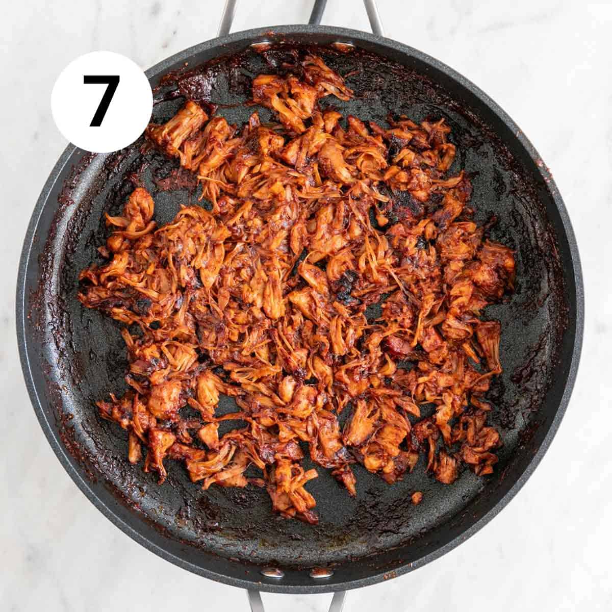 Cooked BBQ jackfruit pulled pork in a skillet.