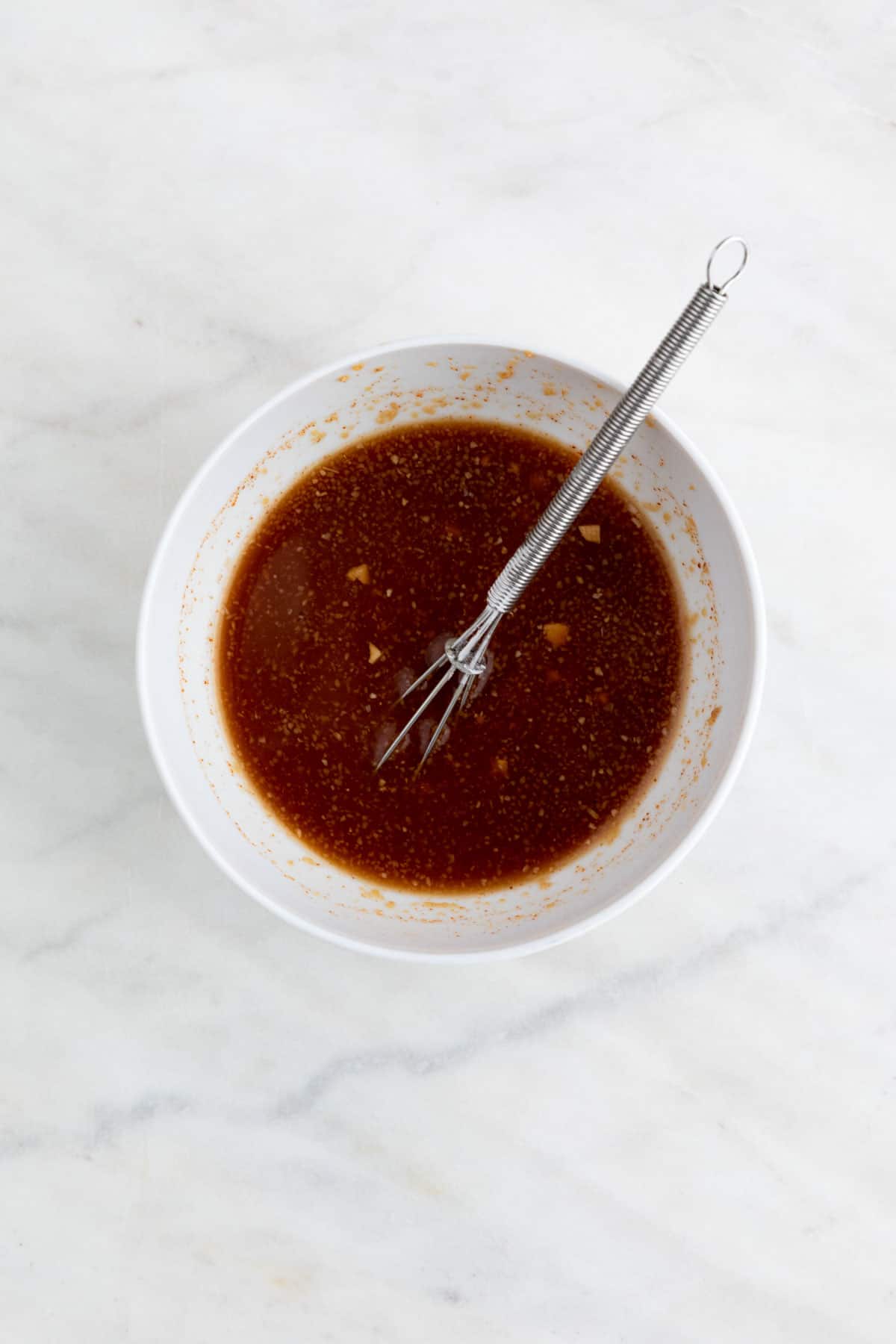 Marinade liquid mixed with the cornstarch in a small bowl.