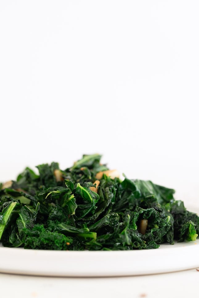 Side shot of a plate of sauteed kale