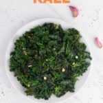 Photo of a plate of sauteed kale with the words sauteed kale