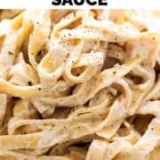 Pasta with vegan Alfredo sauce in a dish.