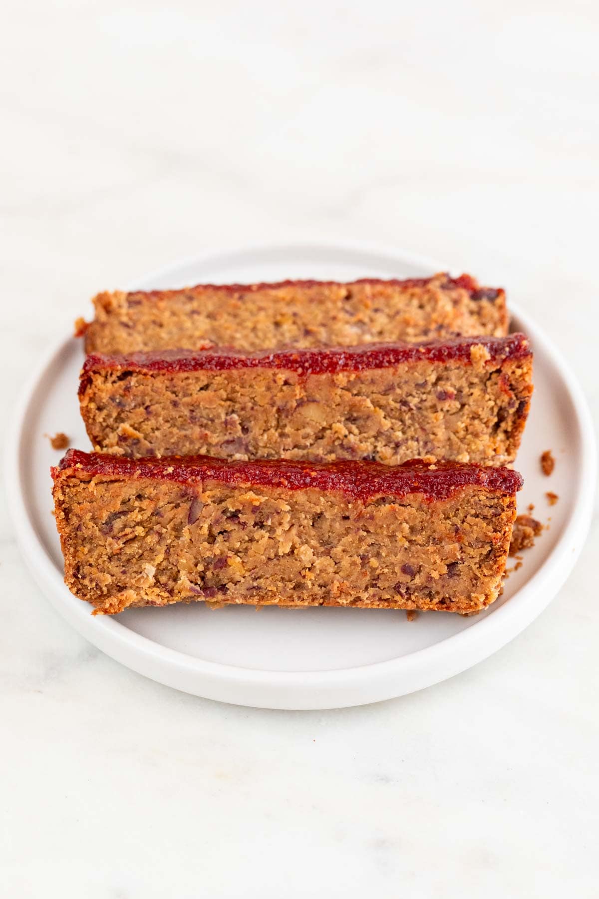 Dish with slices of vegan meatloaf.