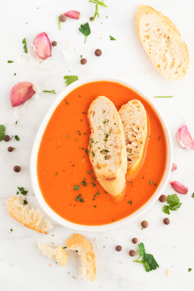 Photo of a bowl of vegan tomato soup taken from the above