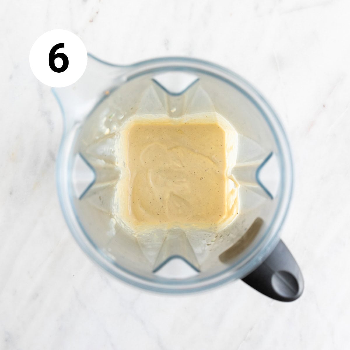 ​​Vegan cashew Alfredo sauce in a blender jar.