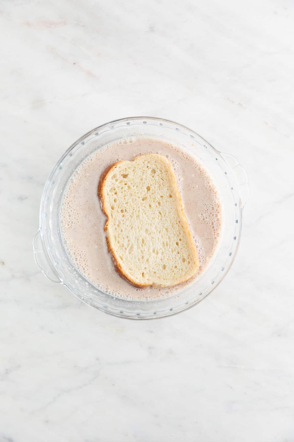 A slice of bread dip into the batter.