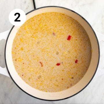 Vegan potato and corn chowder ingredients in a large pot before cooking.