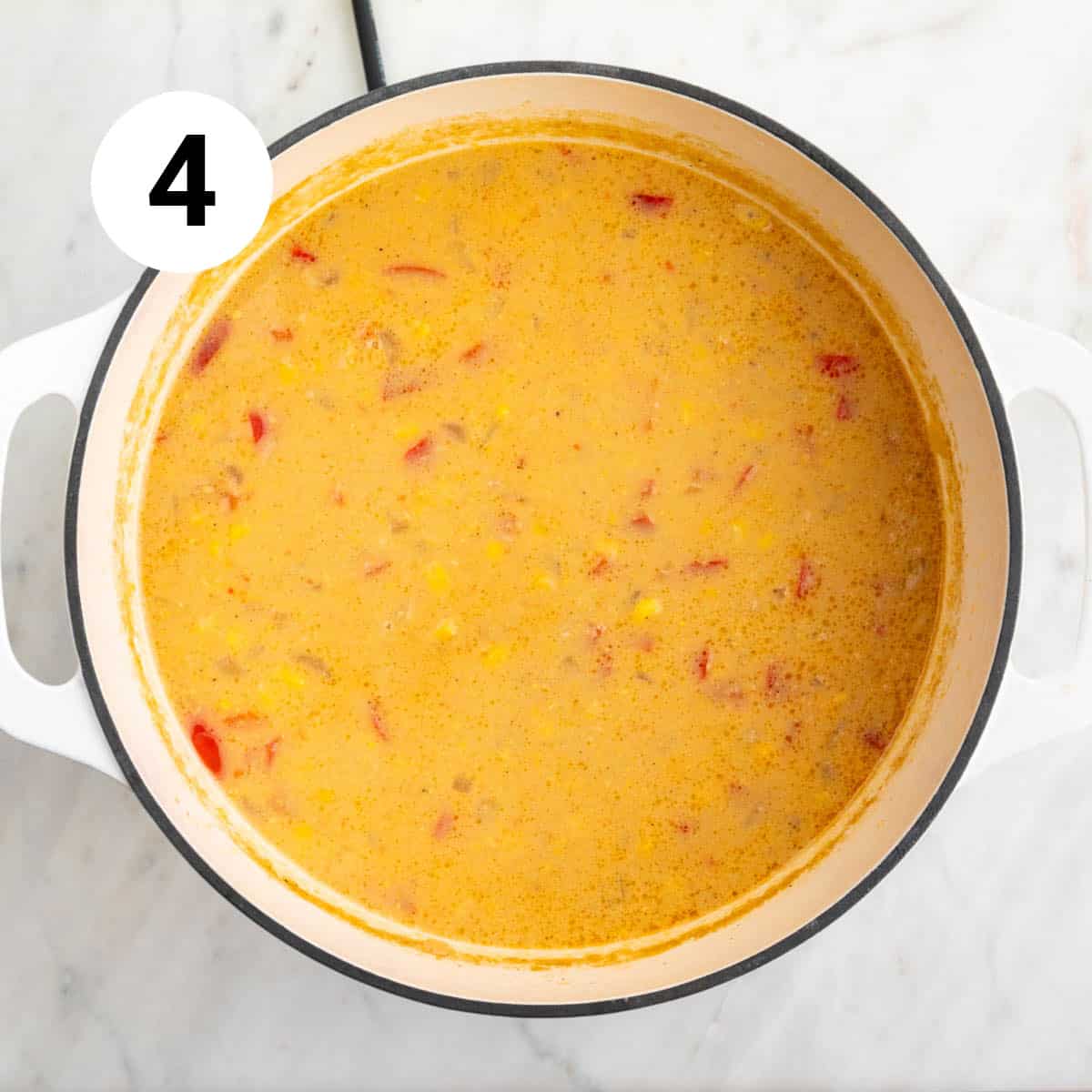 Blended vegan potato and corn chowder in a large pot.