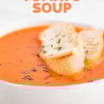 Close-up photo of a vegan tomato soup with the words vegan tomato soup